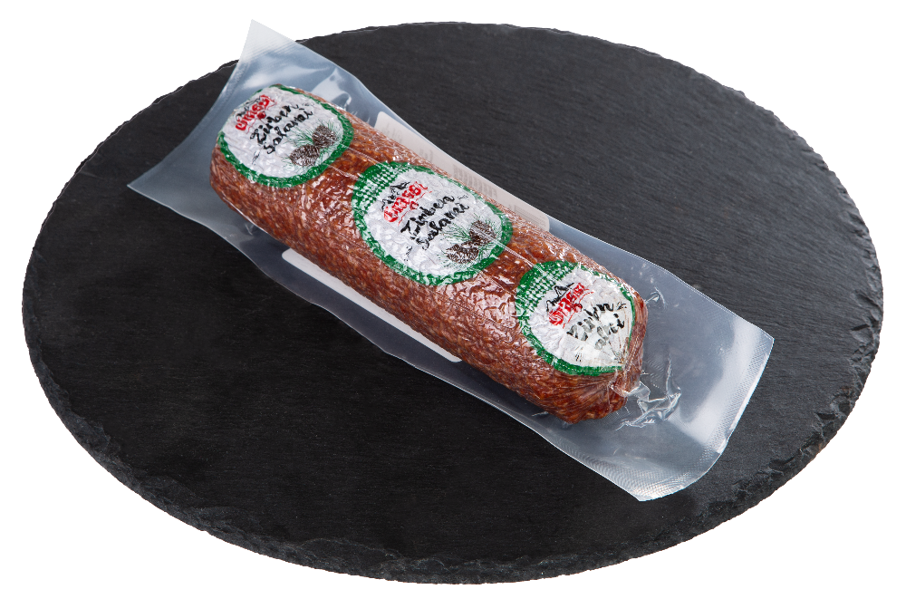 Zirben Salami eingepackt auf Schieferplatte